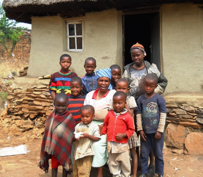 Anna Letokoto and her family outside their house